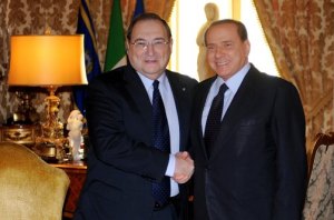 Italy's prime minister Silvio Berlusconi (R) shakes hands with Anti-Defamation League director Abraham Foxman, during their meeting at the Chigi palace in Rome on November 4, 2010. (Alberto Pizzoli / AFP / Getty Images) 
